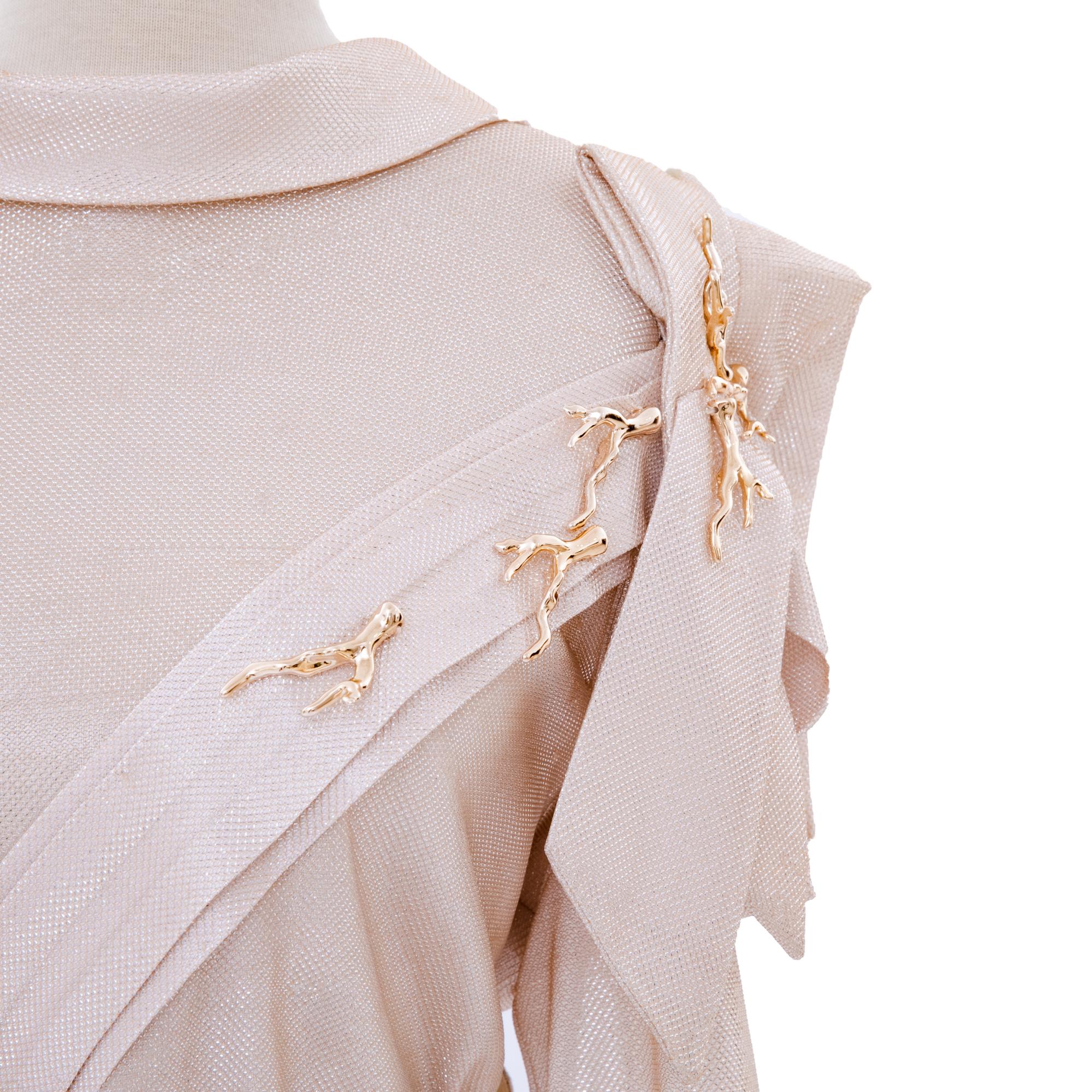 Embroidered cuff detail in gold thread