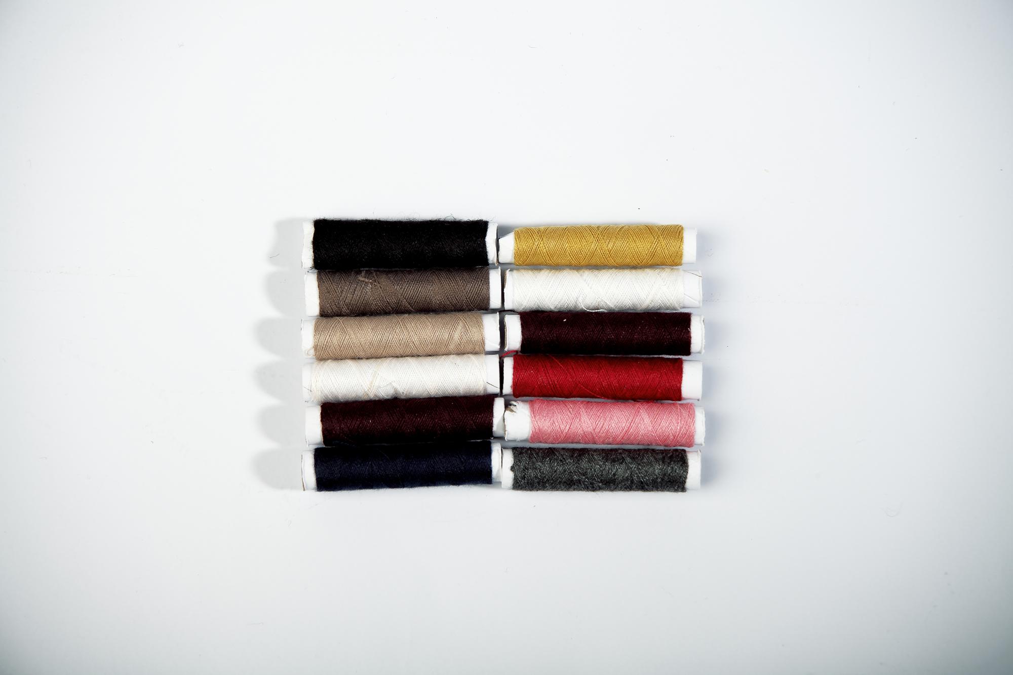 Stack of embroidered samples on fabric
